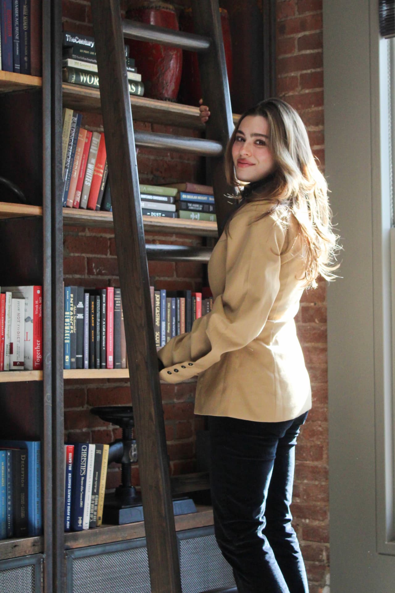 Caroline Walker, Douglas Elliman real estate agent, in a bright Manhattan apartment